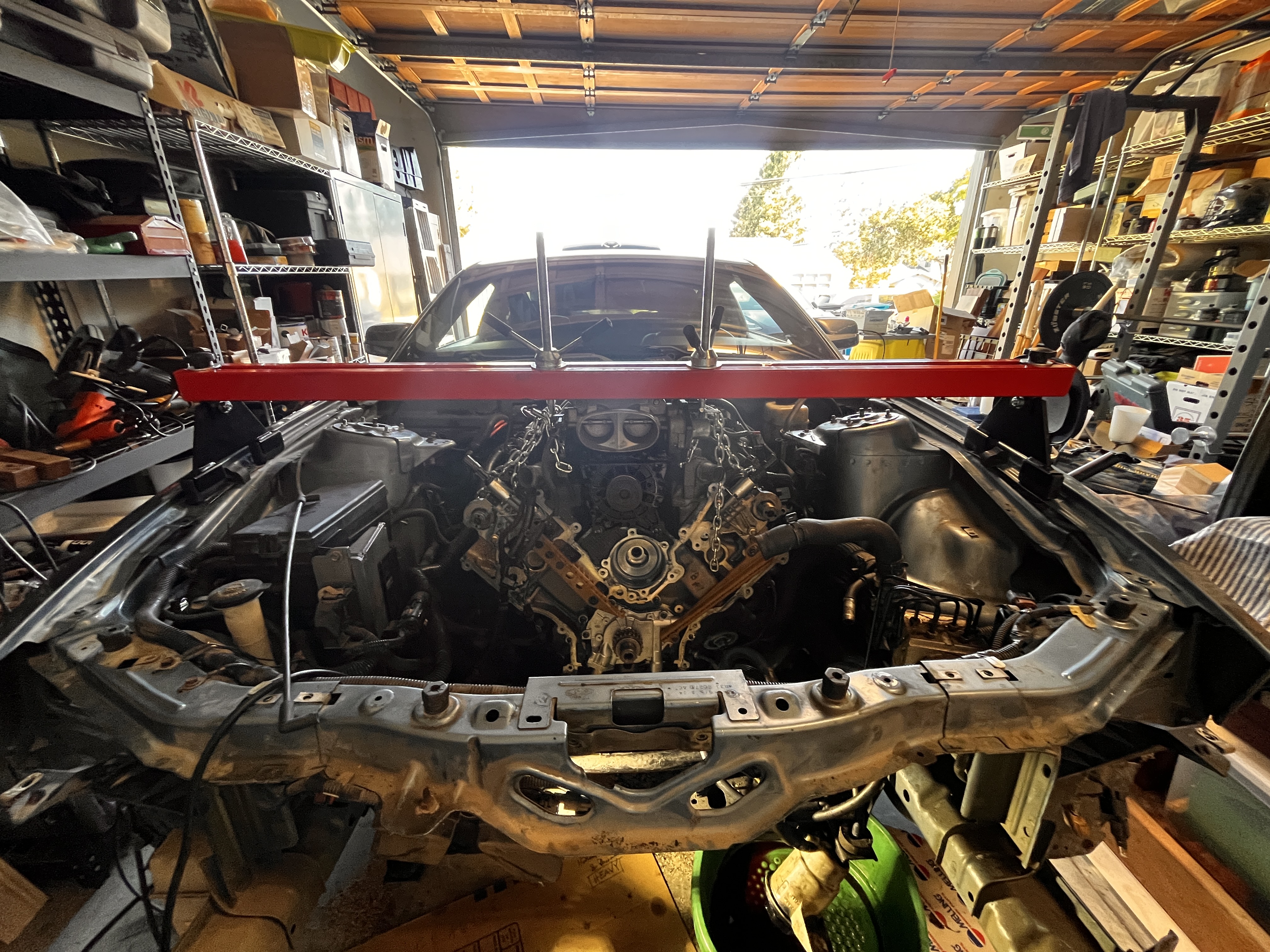Mustang engine disconnected and prepared for removal